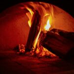 Discover the differences between brick oven pizza and wood fired pizza. Learn about cooking techniques, flavor profiles, crust textures, and tips for the perfect pizza experience.